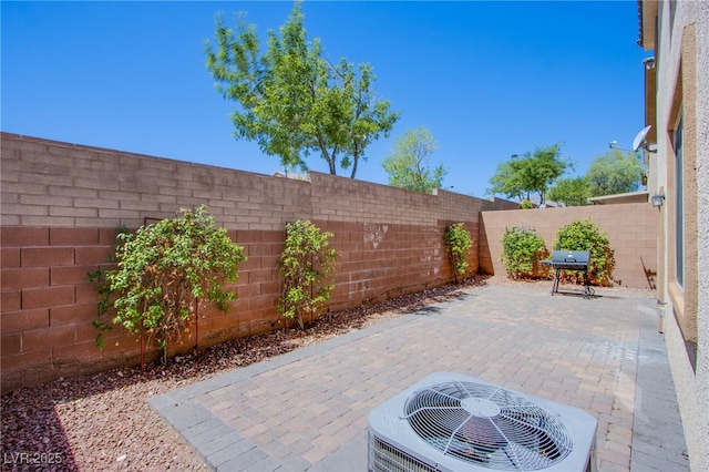 10633 Mount Blackburn Ave, Las Vegas, NV 89166 - fenced backyard with a patio area and area for grilling