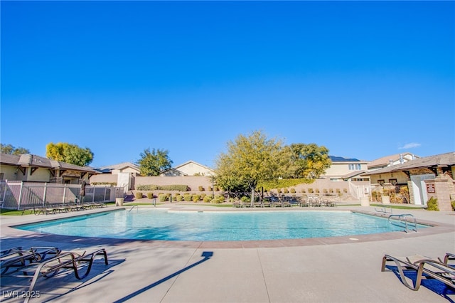 10633 Mount Blackburn Ave, Las Vegas, NV 89166 - community pool featuring a patio and a residential view