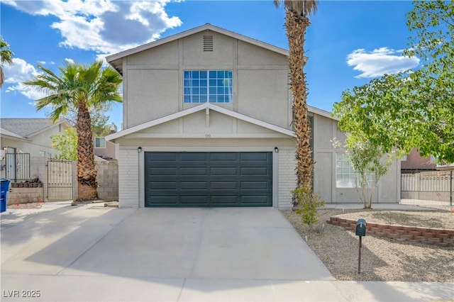 730 Arrowhead Trl, Henderson, NV 89002 - view of front of house featuring a garage, driveway, a gate, and brick siding