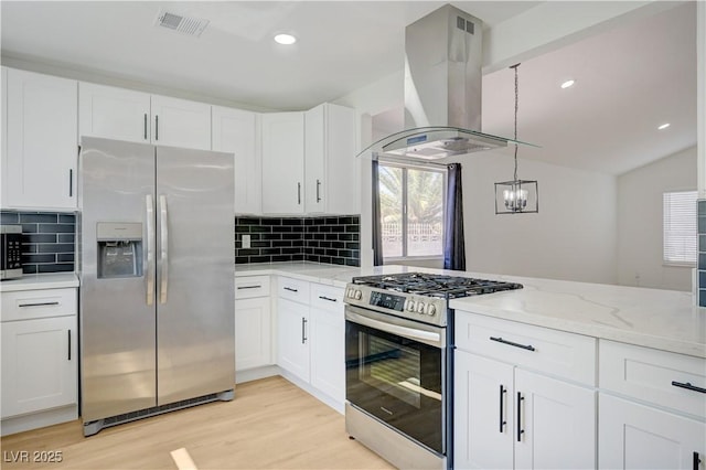 730 Arrowhead Trl, Henderson, NV 89002 - kitchen with appliances with stainless steel finishes, island range hood, light wood-type flooring, white cabinetry, and tasteful backsplash