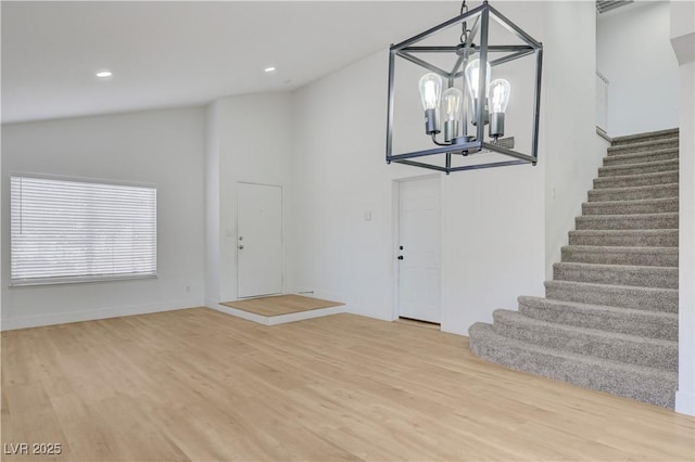 730 Arrowhead Trl, Henderson, NV 89002 - entryway with stairs, wood finished floors, lofted ceiling, recessed lighting, and a chandelier