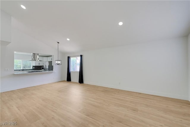 730 Arrowhead Trl, Henderson, NV 89002 - unfurnished living room with light wood-type flooring, recessed lighting, and high vaulted ceiling