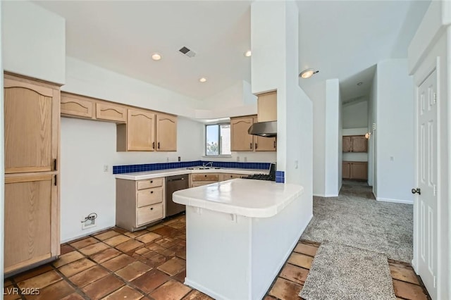 4616 Silversword Ave, North Las Vegas, NV 89032 - kitchen with stainless steel dishwasher, under cabinet range hood, light brown cabinets, a peninsula, and light countertops