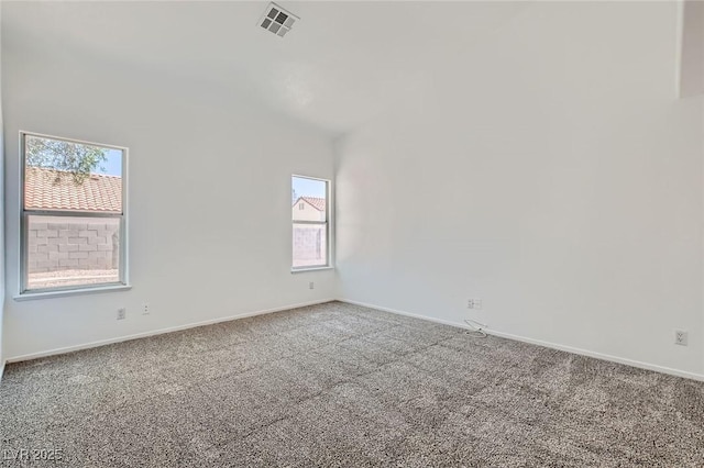 4616 Silversword Ave, North Las Vegas, NV 89032 - spare room with carpet and vaulted ceiling