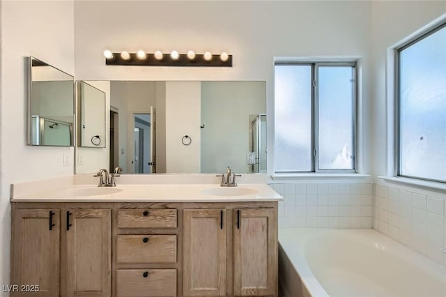 4616 Silversword Ave, North Las Vegas, NV 89032 - bathroom featuring a garden tub and double vanity