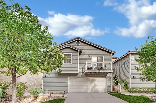 3080 Yankee Clipper Dr, Las Vegas, NV 89117 - view of front of home featuring concrete driveway, stairs, a balcony, and an attached garage