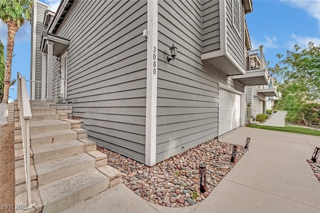 3080 Yankee Clipper Dr, Las Vegas, NV 89117 - view of property exterior with a balcony, concrete driveway, and an attached garage