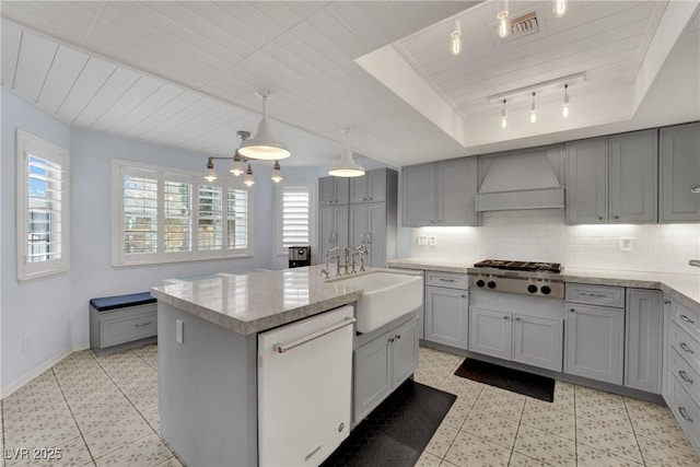 3080 Yankee Clipper Dr, Las Vegas, NV 89117 - kitchen with custom range hood, dishwasher, gray cabinetry, stainless steel gas stovetop, and wood ceiling