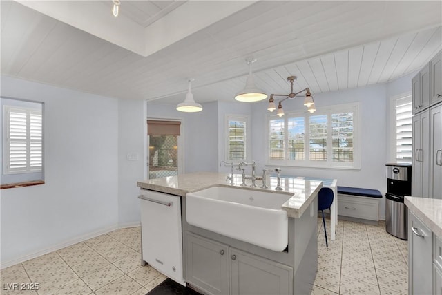 3080 Yankee Clipper Dr, Las Vegas, NV 89117 - kitchen featuring light floors, white dishwasher, light stone counters, a chandelier, and hanging light fixtures