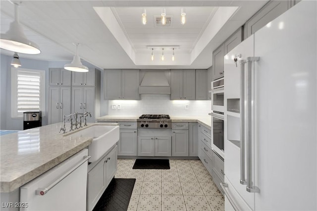 3080 Yankee Clipper Dr, Las Vegas, NV 89117 - kitchen with white appliances, gray cabinets, premium range hood, a raised ceiling, and decorative backsplash