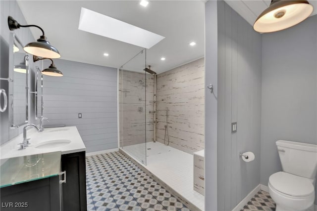3080 Yankee Clipper Dr, Las Vegas, NV 89117 - bathroom with double vanity, a skylight, tile patterned floors, a walk in shower, and recessed lighting