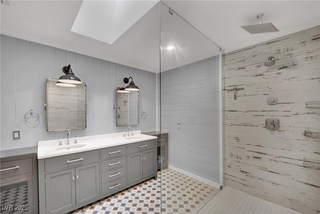 3080 Yankee Clipper Dr, Las Vegas, NV 89117 - full bathroom with a skylight, a stall shower, double vanity, wood walls, and tile patterned floors