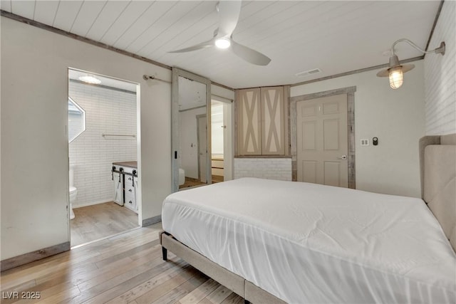 3080 Yankee Clipper Dr, Las Vegas, NV 89117 - bedroom with light wood-type flooring, ceiling fan, and ensuite bathroom
