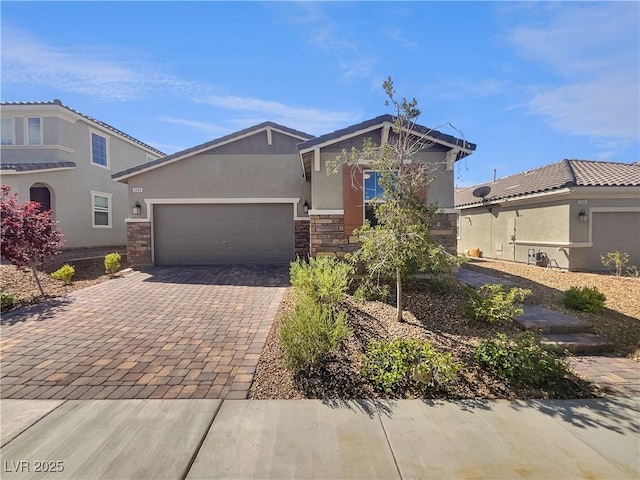 3499 Brezine Ave, Henderson, NV 89044 - view of front of property featuring stone siding, stucco siding, decorative driveway, and a garage