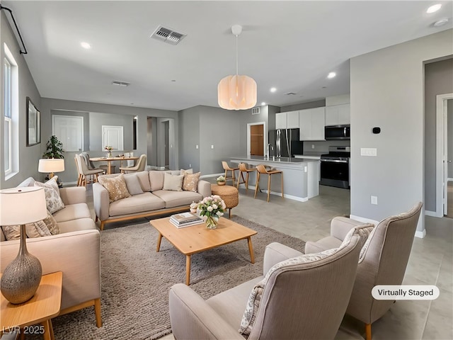 3499 Brezine Ave, Henderson, NV 89044 - living area featuring recessed lighting, light tile patterned floors, and a chandelier