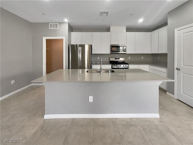 3499 Brezine Ave, Henderson, NV 89044 - kitchen featuring appliances with stainless steel finishes, a kitchen island with sink, white cabinetry, light countertops, and recessed lighting