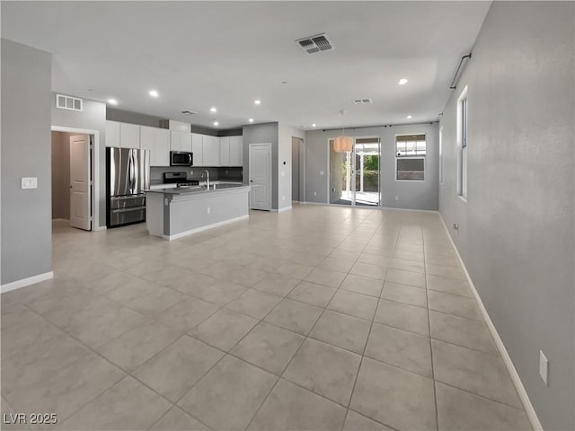 3499 Brezine Ave, Henderson, NV 89044 - unfurnished living room featuring recessed lighting and light tile patterned flooring