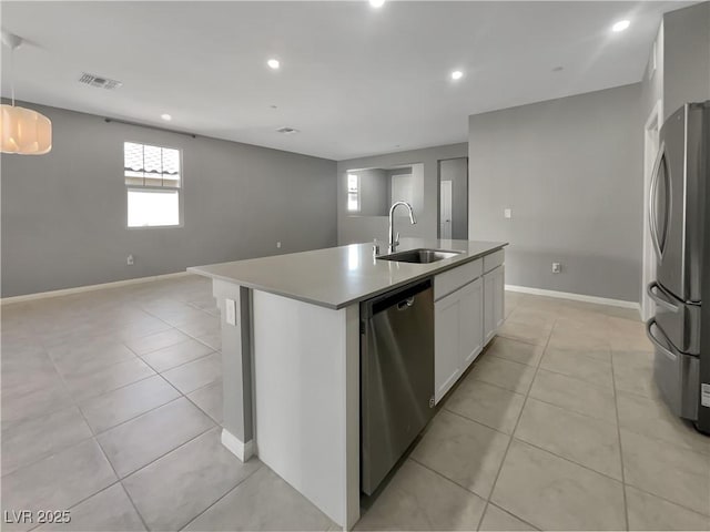 3499 Brezine Ave, Henderson, NV 89044 - kitchen featuring stainless steel appliances, light tile patterned floors, a center island with sink, open floor plan, and recessed lighting
