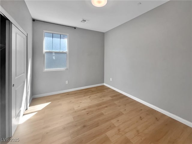 3499 Brezine Ave, Henderson, NV 89044 - unfurnished bedroom with light wood-style flooring and a closet