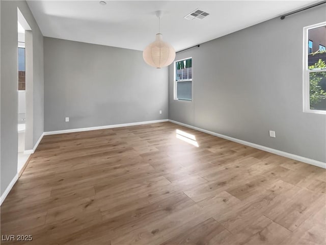 3499 Brezine Ave, Henderson, NV 89044 - spare room with healthy amount of natural light and wood finished floors