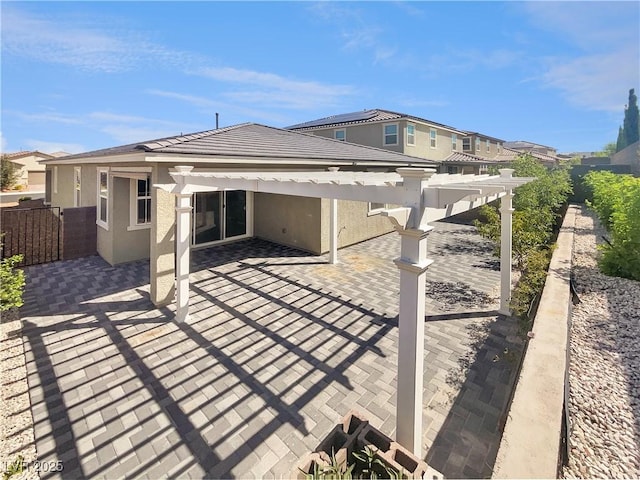 3499 Brezine Ave, Henderson, NV 89044 - back of property featuring a pergola, a patio area, and stucco siding