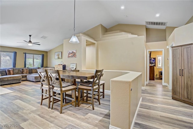 7401 Red Swallow St, Las Vegas, NV 89131 - dining space with lofted ceiling, light wood-style flooring, and a ceiling fan