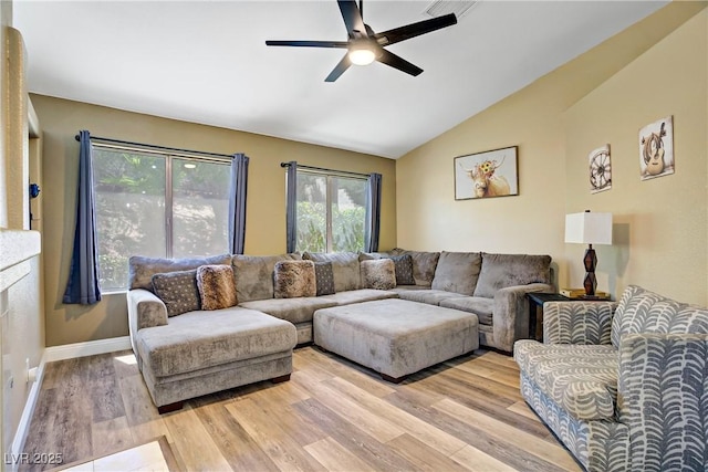7401 Red Swallow St, Las Vegas, NV 89131 - living area featuring a ceiling fan, lofted ceiling, and light wood-style flooring