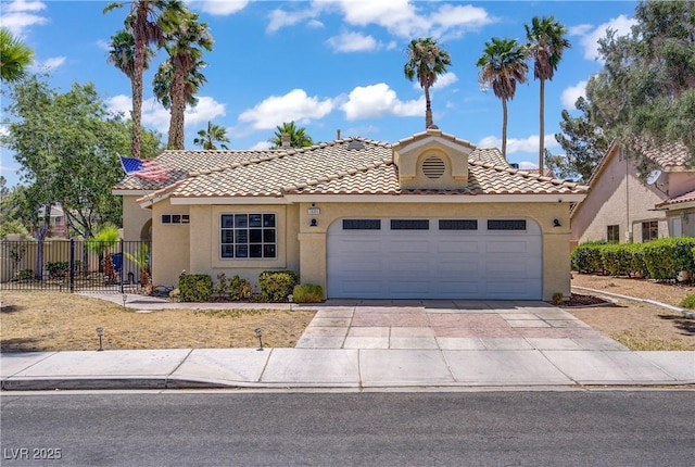 7401 Red Swallow St, Las Vegas, NV 89131 - view of front of home with stucco siding, a tile roof, and concrete driveway