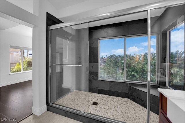 56 Grossinger Ct, Henderson, NV 89074 - bathroom with a shower stall, vanity, and wood finished floors