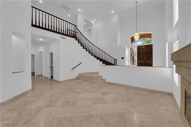 56 Grossinger Ct, Henderson, NV 89074 - foyer with a high ceiling, stairway, recessed lighting, and a chandelier