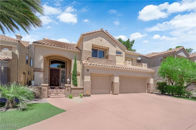 56 Grossinger Ct, Henderson, NV 89074 - mediterranean / spanish-style home featuring stucco siding, driveway, a tile roof, an attached garage, and a gate