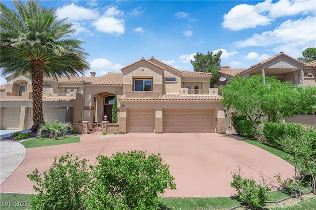 56 Grossinger Ct, Henderson, NV 89074 - mediterranean / spanish home with concrete driveway, a tiled roof, stucco siding, and an attached garage
