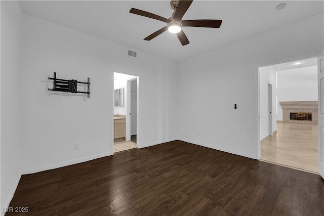 56 Grossinger Ct, Henderson, NV 89074 - unfurnished room with a ceiling fan, wood finished floors, and a fireplace