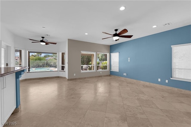 56 Grossinger Ct, Henderson, NV 89074 - unfurnished living room featuring a ceiling fan, recessed lighting, and light tile patterned floors