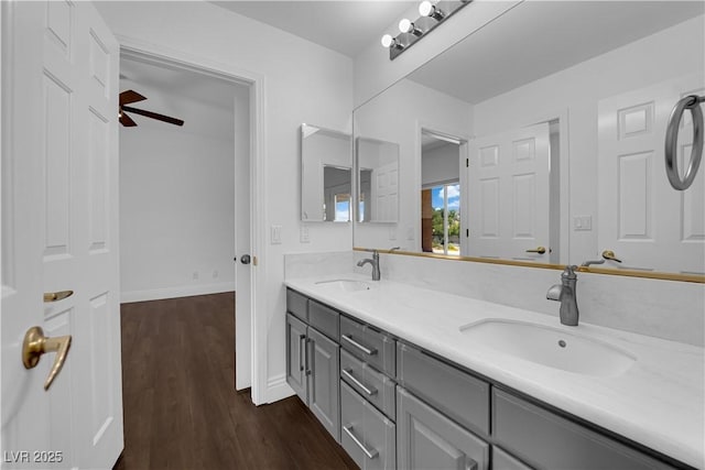 56 Grossinger Ct, Henderson, NV 89074 - bathroom featuring double vanity, wood finished floors, and a ceiling fan