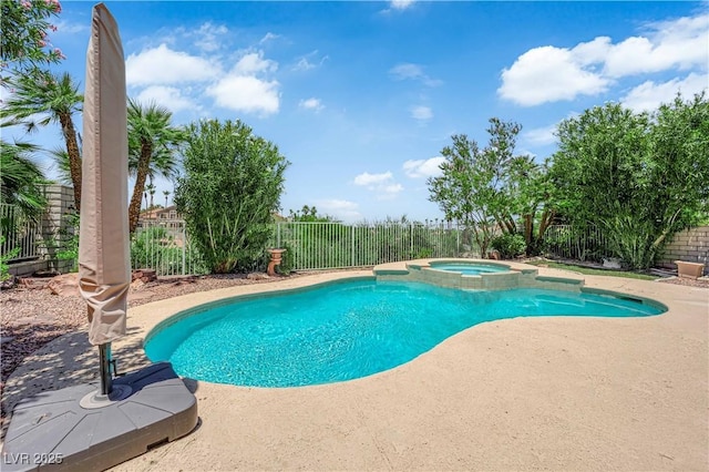 56 Grossinger Ct, Henderson, NV 89074 - view of swimming pool featuring a fenced backyard, a patio area, and a pool with connected hot tub