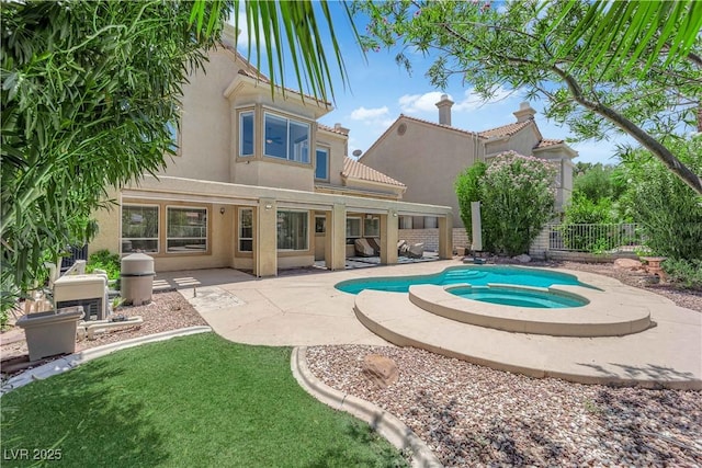 56 Grossinger Ct, Henderson, NV 89074 - view of pool featuring an in-ground hot tub, a fenced backyard, and a patio area