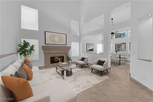 56 Grossinger Ct, Henderson, NV 89074 - living area featuring a high ceiling, light tile patterned floors, and a premium fireplace