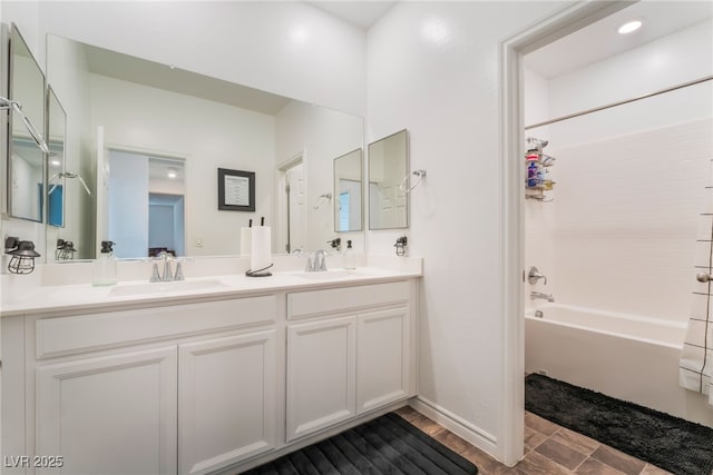7107 Calvert Cliffs St, North Las Vegas, NV 89084 - bathroom featuring shower / bathtub combination and double vanity