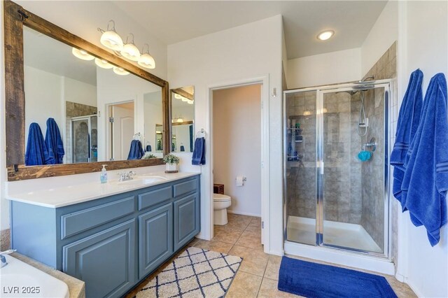 8169 Skytop Ledge Ave, Las Vegas, NV 89178 - bathroom featuring tile patterned floors, a stall shower, and vanity