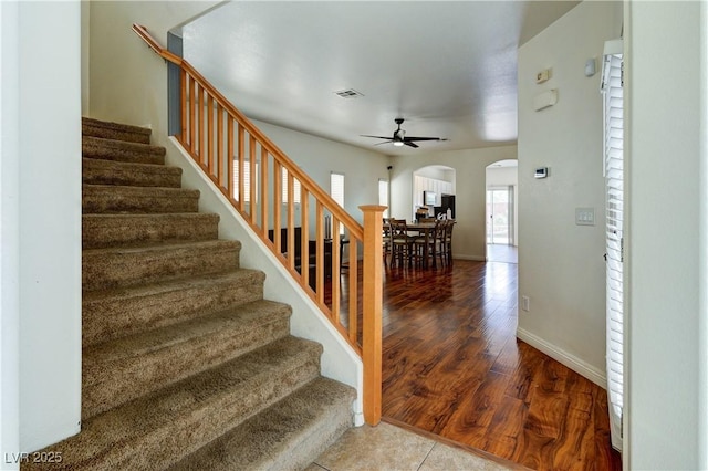 8169 Skytop Ledge Ave, Las Vegas, NV 89178 - stairs featuring arched walkways, a ceiling fan, and wood finished floors