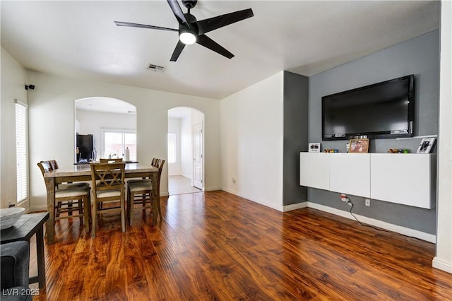 8169 Skytop Ledge Ave, Las Vegas, NV 89178 - dining area featuring arched walkways, ceiling fan, and wood finished floors