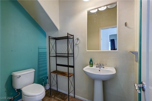 8169 Skytop Ledge Ave, Las Vegas, NV 89178 - half bathroom with toilet and tile patterned flooring