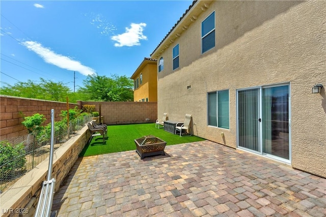 8169 Skytop Ledge Ave, Las Vegas, NV 89178 - fenced backyard featuring a fire pit and a patio