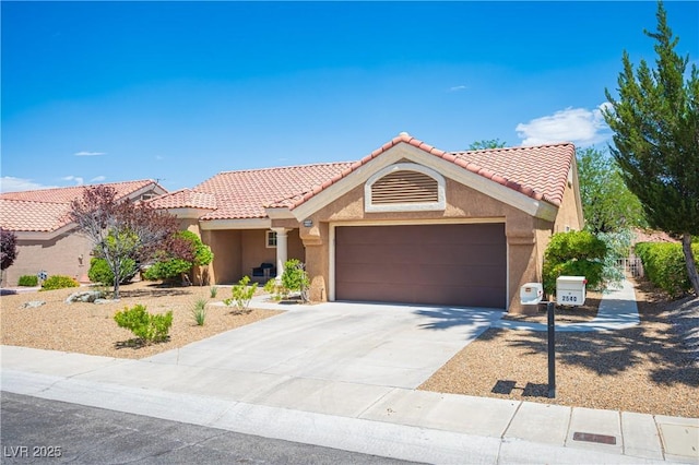 2548 Tumble Brook Dr, Las Vegas, NV 89134 - view of front of property featuring stucco siding, a garage, a tile roof, and concrete driveway