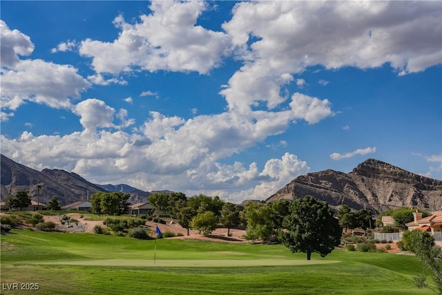 2548 Tumble Brook Dr, Las Vegas, NV 89134 - surrounding community with a mountain view, a yard, and golf course view