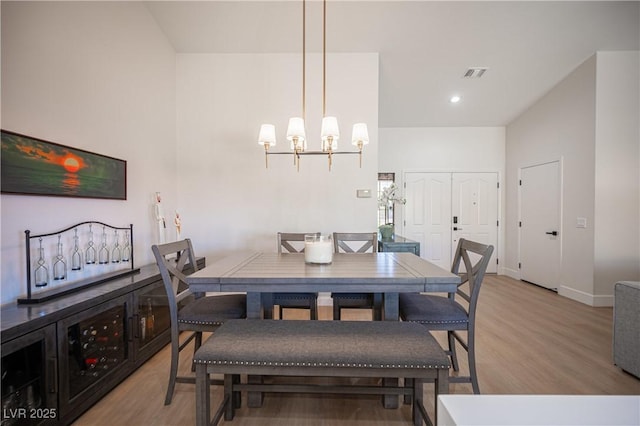 2548 Tumble Brook Dr, Las Vegas, NV 89134 - dining area featuring light wood-style flooring and a chandelier
