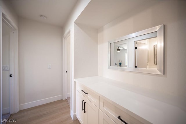 2548 Tumble Brook Dr, Las Vegas, NV 89134 - hallway featuring light wood-style floors and baseboards