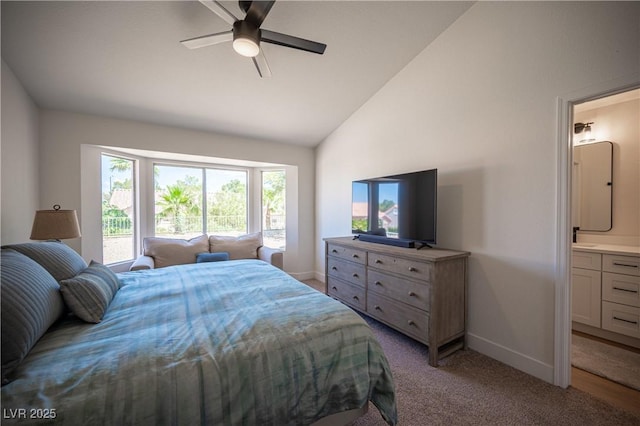 2548 Tumble Brook Dr, Las Vegas, NV 89134 - bedroom with light colored carpet, ensuite bathroom, a ceiling fan, and high vaulted ceiling