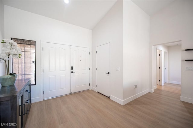 2548 Tumble Brook Dr, Las Vegas, NV 89134 - entrance foyer featuring light wood-style flooring and high vaulted ceiling